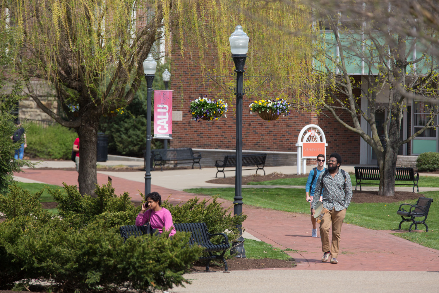 Student walk through PennWest California's campus.
