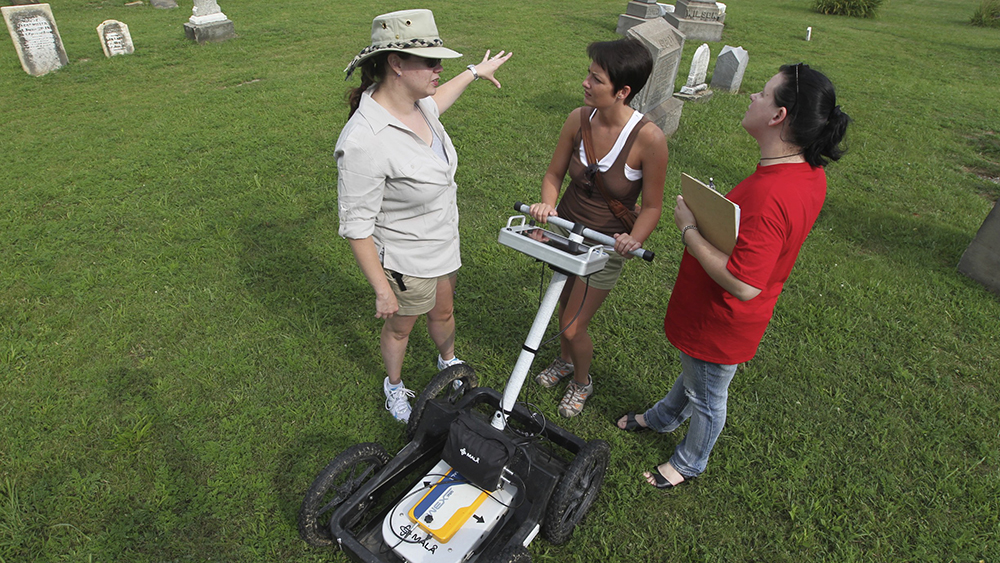PennWest California archaeology students use ground penetrating radar at a church.