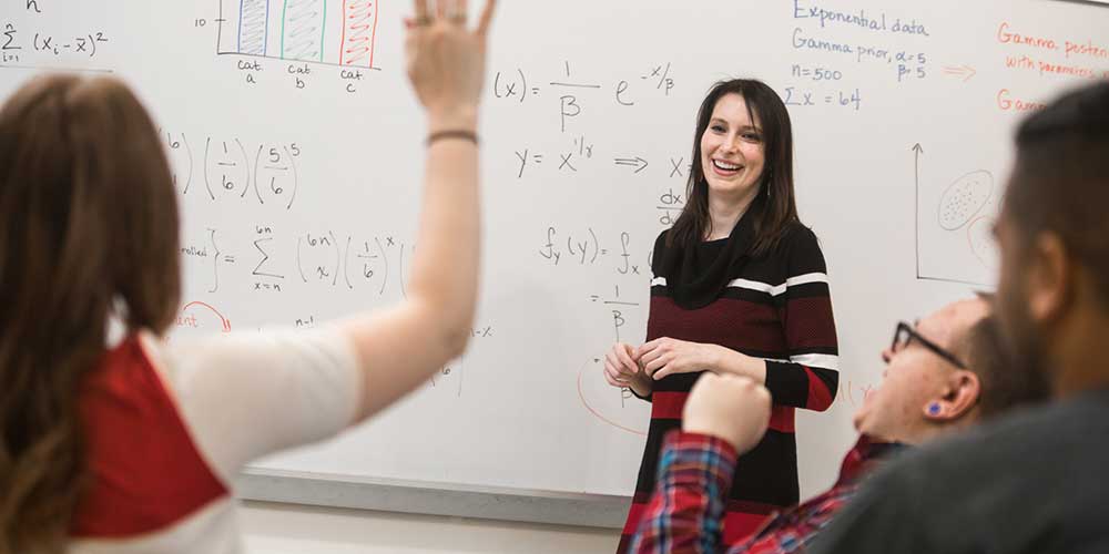 Data Science students work in a classroom.