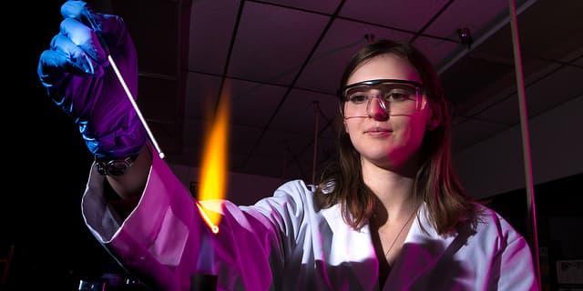A Cal U student performs biology research.