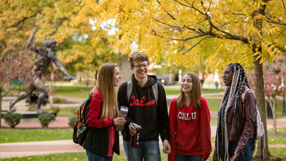 Students laugh on campus.