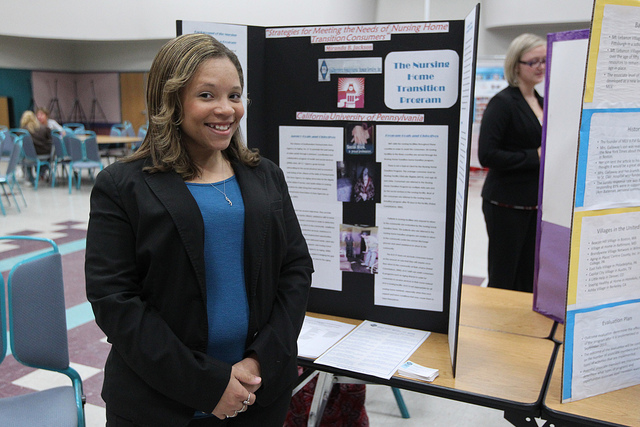 A student showcases research.
